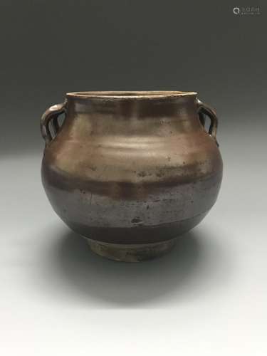 A BROWN GLAZE JAR