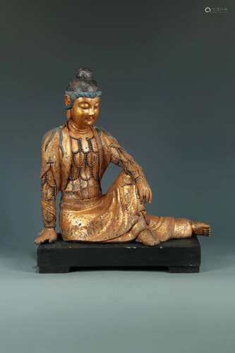 A WOODEN FIGURE OF BUDDHA