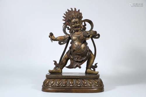 A GILT-BRONZE FIGURE OF MAHAKALA