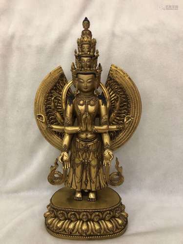 A GILT-BRONZE FIGURE OF EKADASHAMUKHA-LOKESHVARA