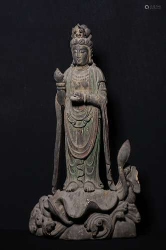 A XIANGZHANG WOOD FIGURE OF STANDING GUANYIN