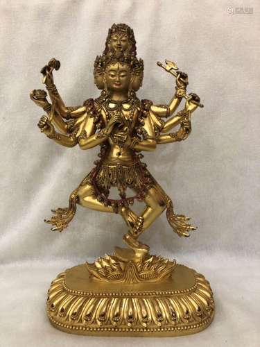 A GILT-BRONZE FIGURE OF EKADASHAMUKHA-LOKESHVARA