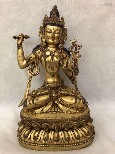 A GILT-BRONZE FIGURE OF TARA