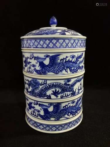 A BLUE AND WHITE THREE-TRAY FOOD BOX, KANGXI MARK