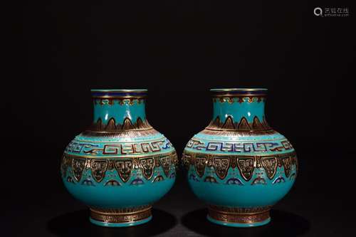 A PAIR OF BLUE GLAZE VASES