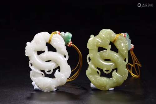 A PAIR OF JADE ORNAMENTS