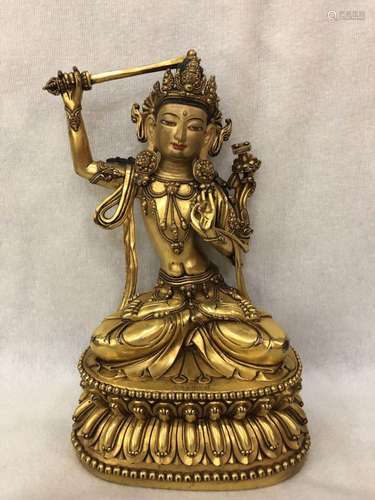 A GILT-BRONZE FIGURE OF MANJUSHRI