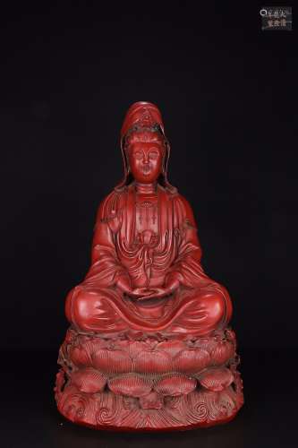 A RED LACQUER GUANYIN SHAPED ORNAMENT