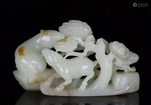 A HETIAN JADE ORNAMENT OF BEAST SHAPED