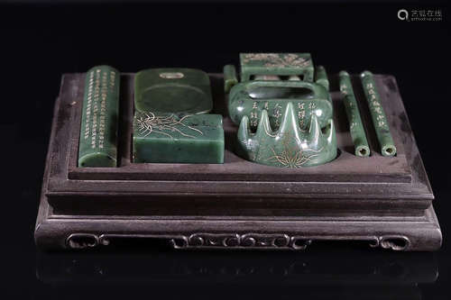 A SEVEN-PIECE HETIAN GREEN JADE STATIONERIES