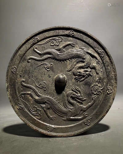 A BRONZE MIRROR WITH TWO DRAGON PATTERN