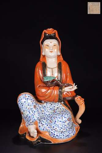 A RED GLAZE PORCELAIN GUANYIN SHAPED ORNAMENT