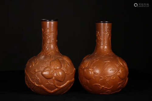 A PAIR OF POTTERY VASES