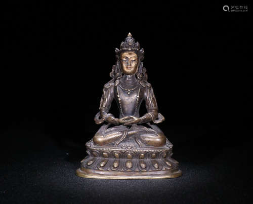 A BRONZE SITTING GUANYIN ORNAMENT