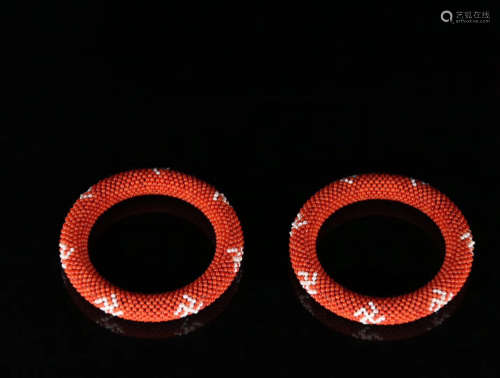 A PAIR OF RED CORAL BANGLES
