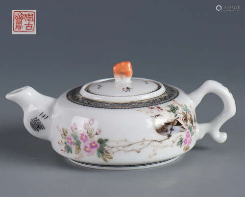 A PORCELAI TEAPOT WITH SCENERY PATTERNS AND MARKING