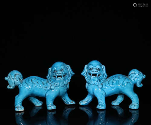 A PAIR OF OLD BLUE GLAZED PORCELAIN ORNAMENTS SHAPED LION