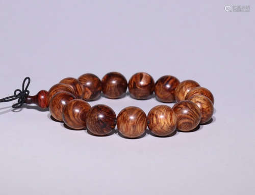 A HUANGHUA WOOD BRACELET