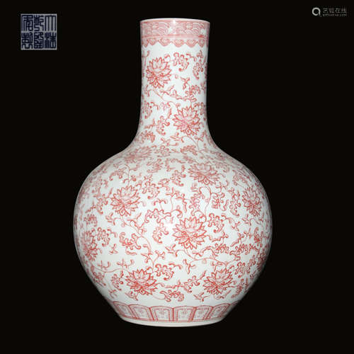 A RED PORCELAIN VASE WITH FLOWER PATTERNS AND QIANLONG MARKING