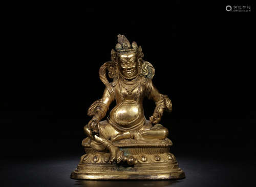 A GILT BRONZE BUDDHA ORNAMENT