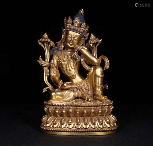 A GILT BRONZE GUANYIN SHAPED BUDDHA