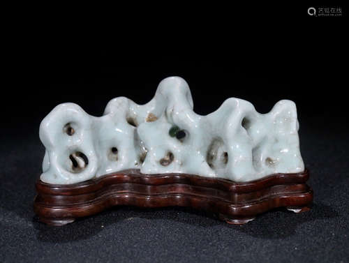 A WHITE GLAZED PORCELAIN SHAPED MOUNTAIN ORNAMENT