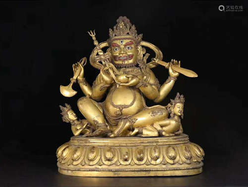 A GILT BRONZE BUDDHA ORNAMENT