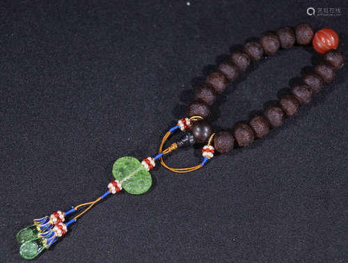 A CHENXIANG WOOD BRACELET WITH 18 BEADS