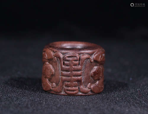 A CHENXIANG WOOD THUMB RING WITH SHOU CHARACTER