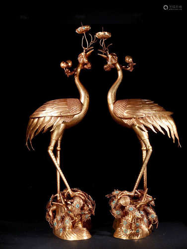 A PAIR OF GILT BRONZE CRESSETS SHAPED CRANE