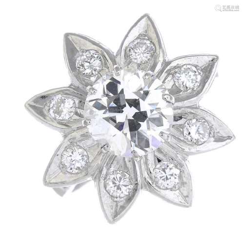 A diamond floral cluster ring. The circular-cut