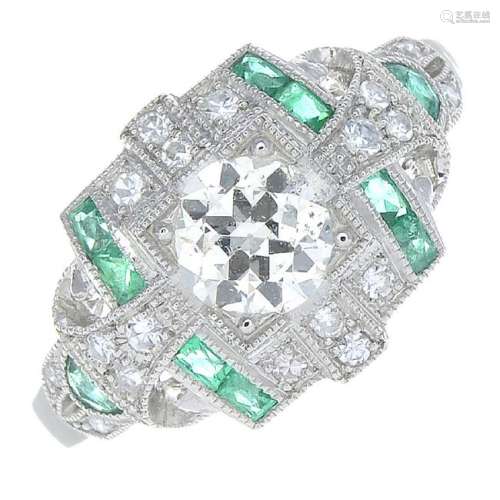 A diamond and emerald ring. The old-cut diamond, with
