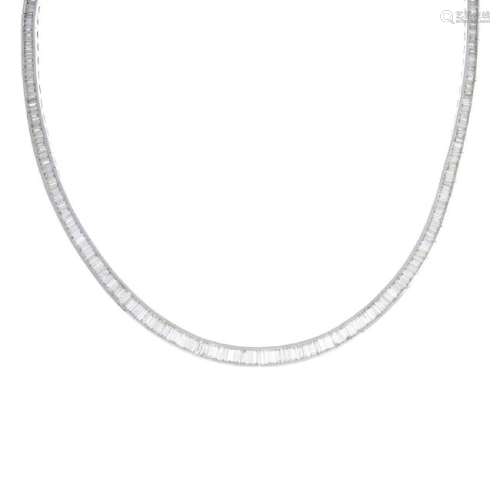 A diamond necklace. The slightly graduated baguette-cut