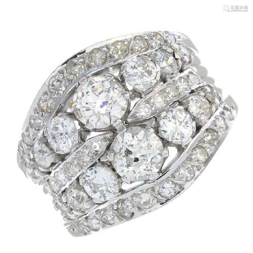 An 18ct gold diamond ring. Of openwork design, the