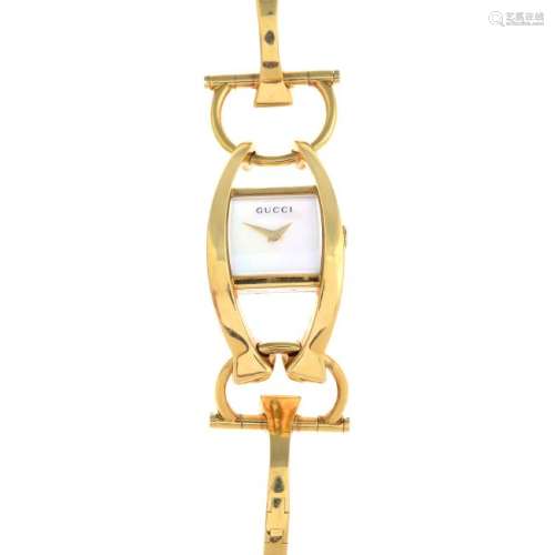 GUCCI - an 18ct gold 'Horsebit' wristwatch. The