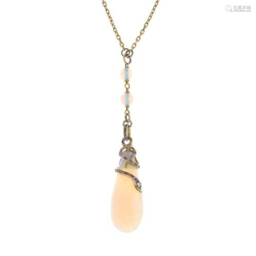 A gold opal, ruby and diamond necklace. The opal drop,