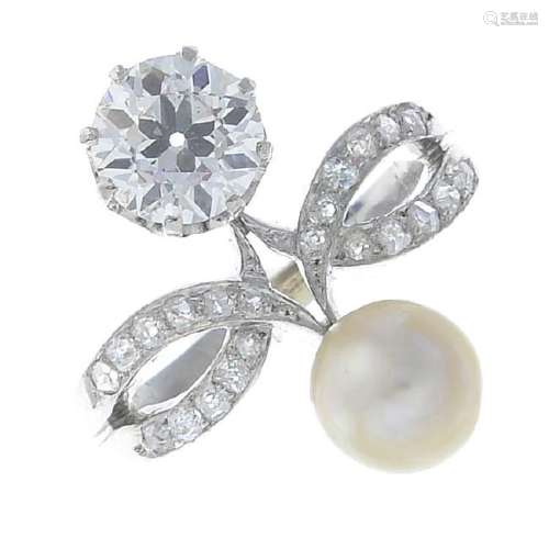 A diamond and natural pearl dress ring. The vari-cut