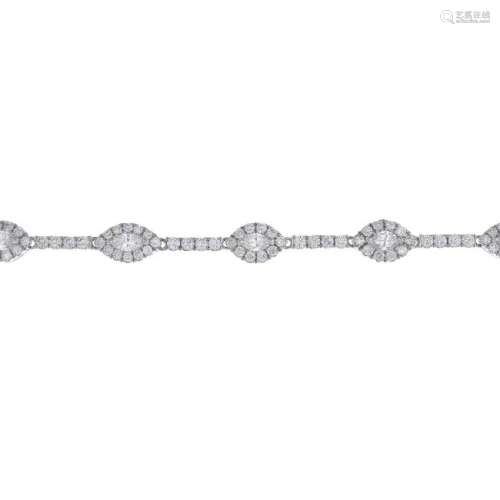 A platinum diamond bracelet. Designed as a series of