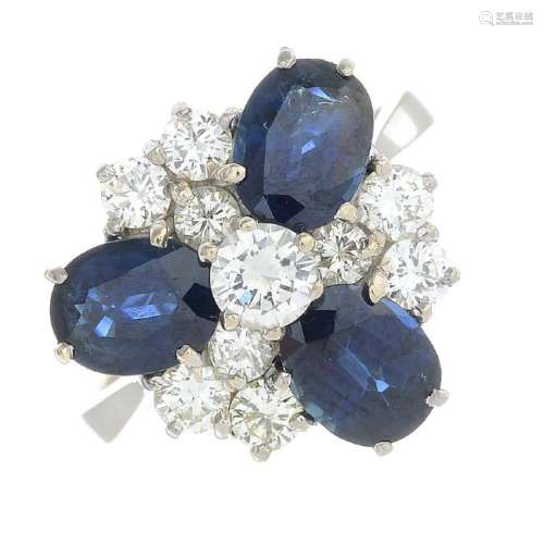 A sapphire and diamond cluster ring. The brilliant-cut