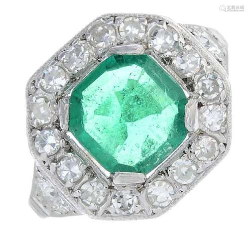 A Colombian emerald and diamond ring. The octagonal-cut