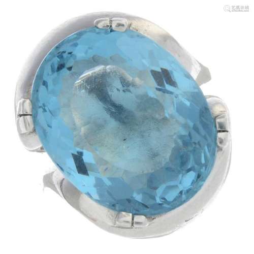 A platinum aquamarine single-stone ring. Of abstract