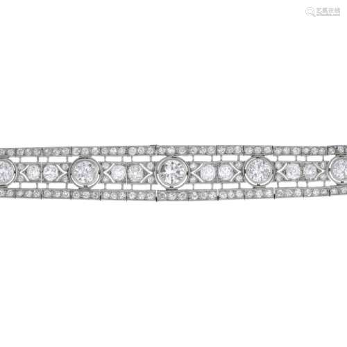 An Art Deco platinum diamond bracelet. Of openwork