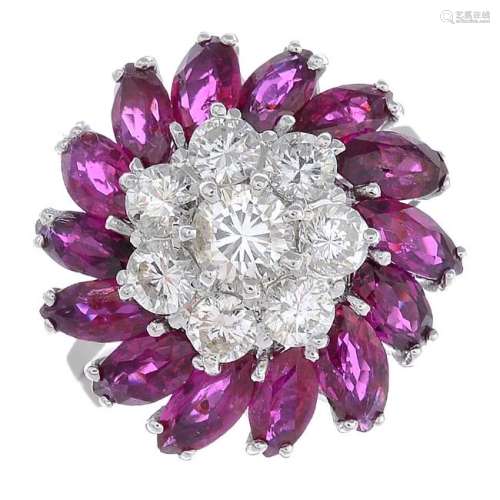 A ruby and diamond floral dress ring. The brilliant-cut