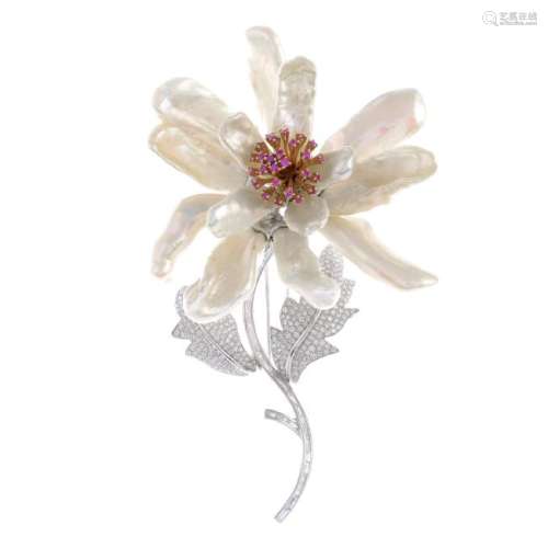 An 18ct gold diamond and gem-set floral brooch. The