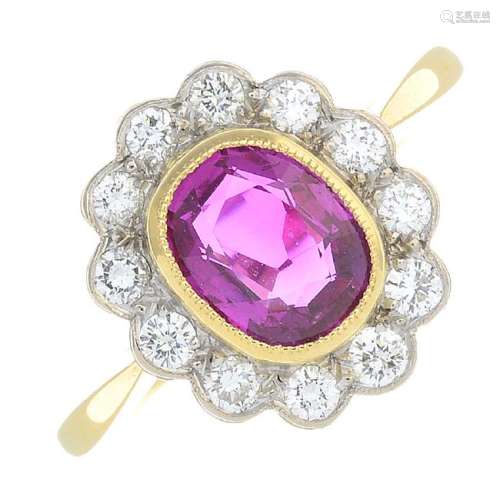 An 18ct gold Burmese ruby and diamond cluster ring. The