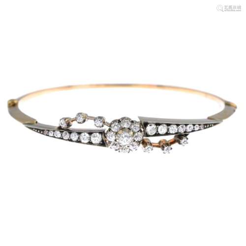 A late Victorian gold diamond hinged bangle. The