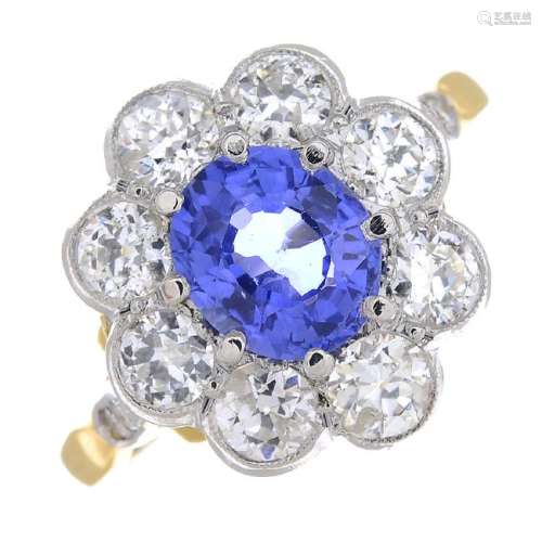 A sapphire and diamond floral cluster ring. The