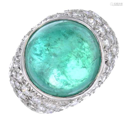 A platinum Colombian emerald and diamond ring. Of bombe