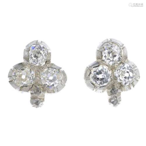 A pair of diamond earrings. Each designed as an old-cut