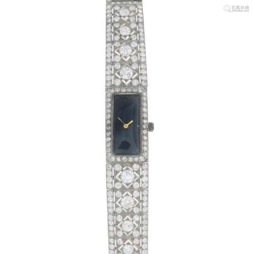 A mid 20th century platinum diamond cocktail watch. The